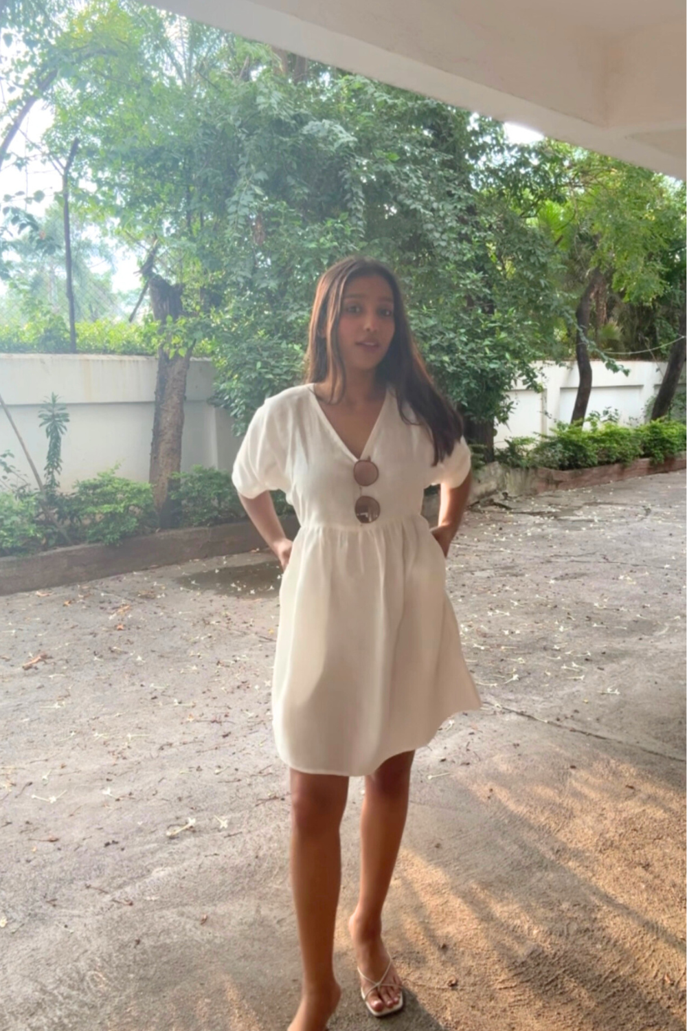 Model wearing White Smurf Mini Dress outdoors