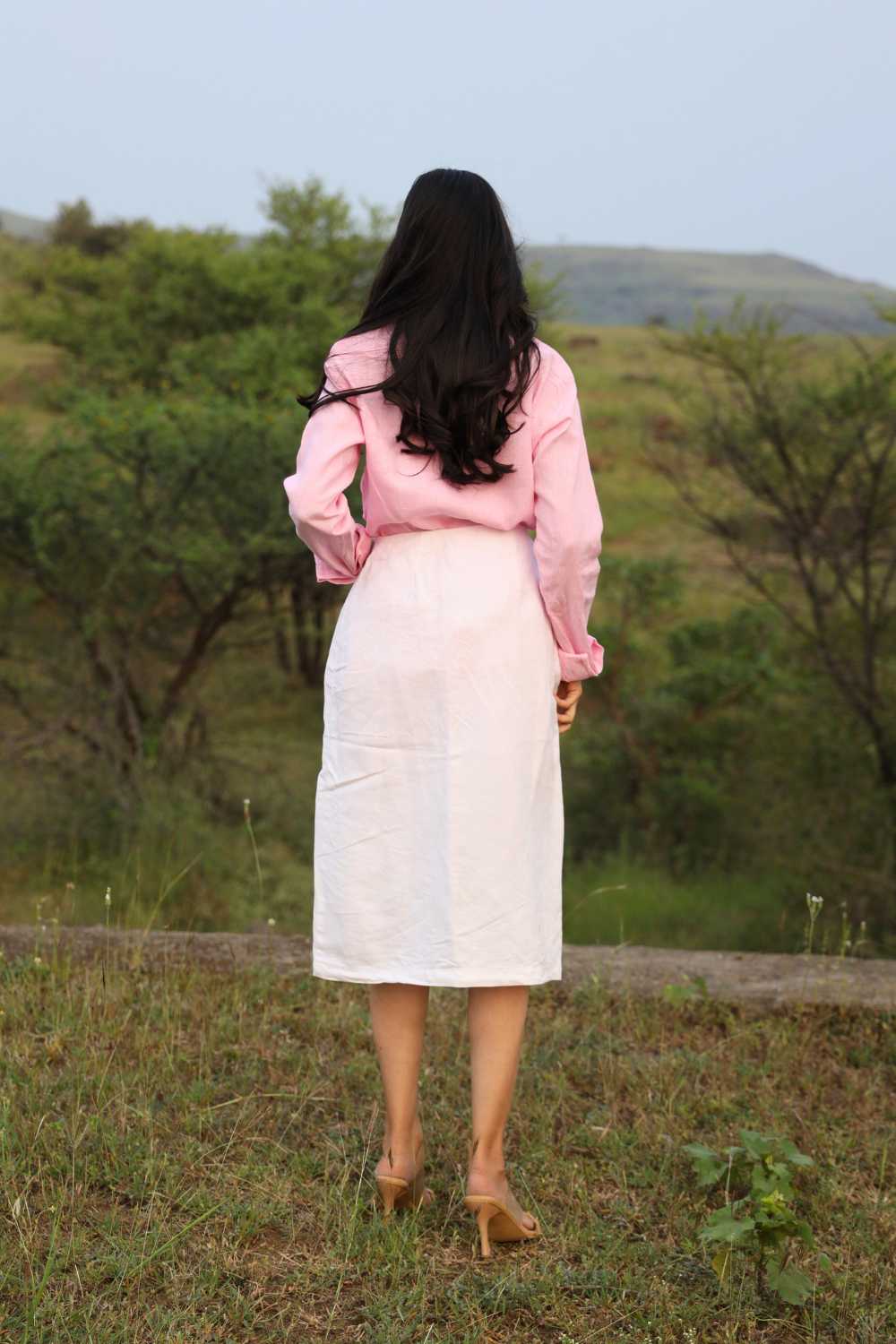 Side view of sustainable White Truffle skirt on model