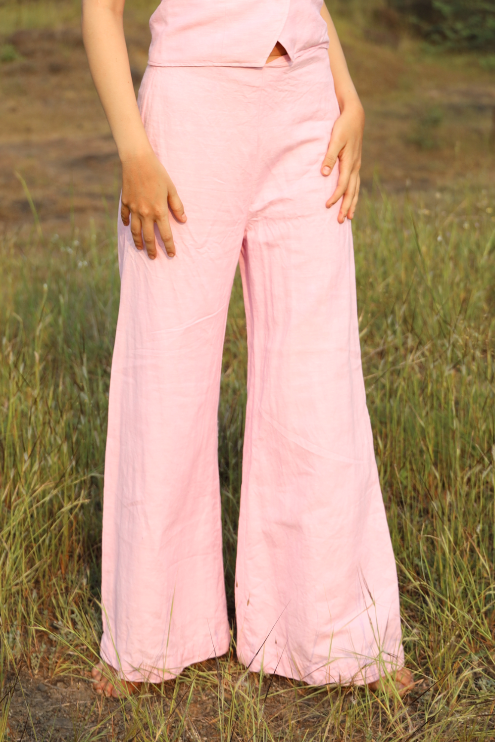 Pink Candy pants styled with matching waistcoat on model