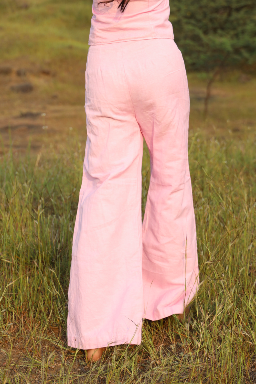 Pink Candy pants styled with matching waistcoat on model