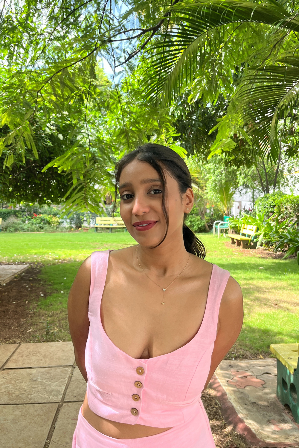 Pink Candy crop top with wooden buttons worn by model